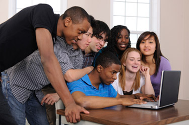 students watching a video on a laptop
